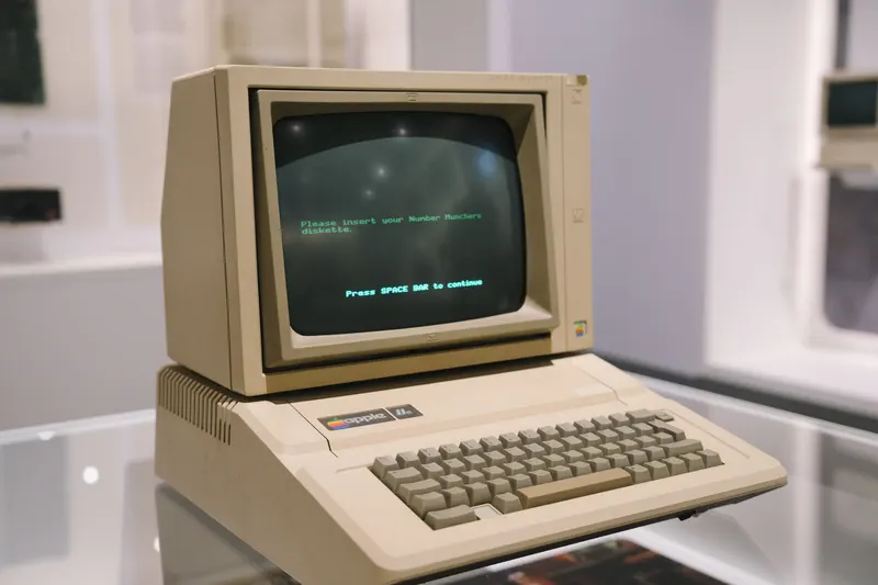 A beige personal computer with a tube monitor showing green text.
