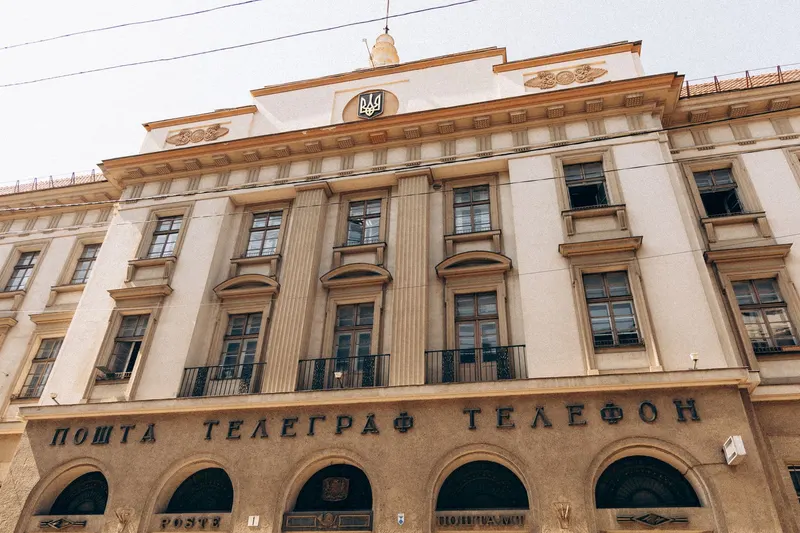 The facade of a post, telegraph, and telephone building with Cyrillic lettering beneath the cornice.