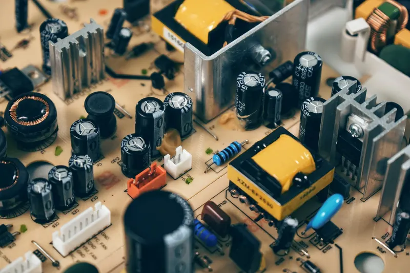 A circuit board with soldered resistors, capacitors, and transformers.