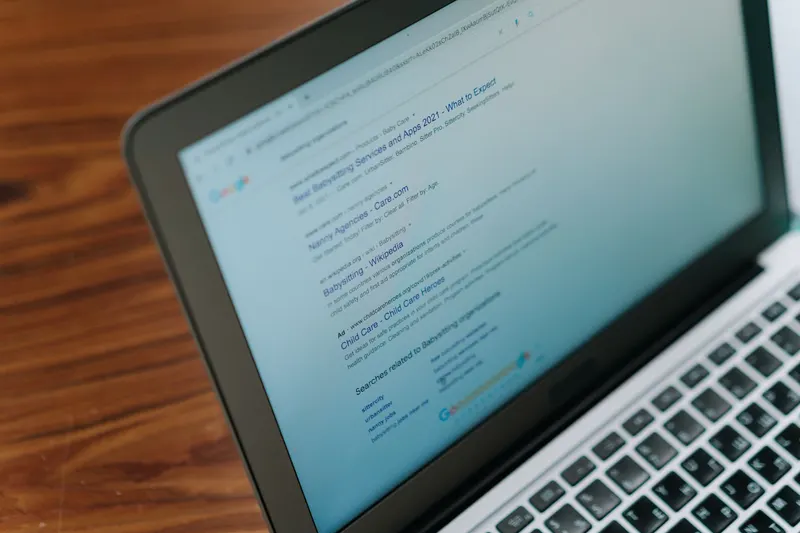 A laptop displaying a web page, seen at an angle.